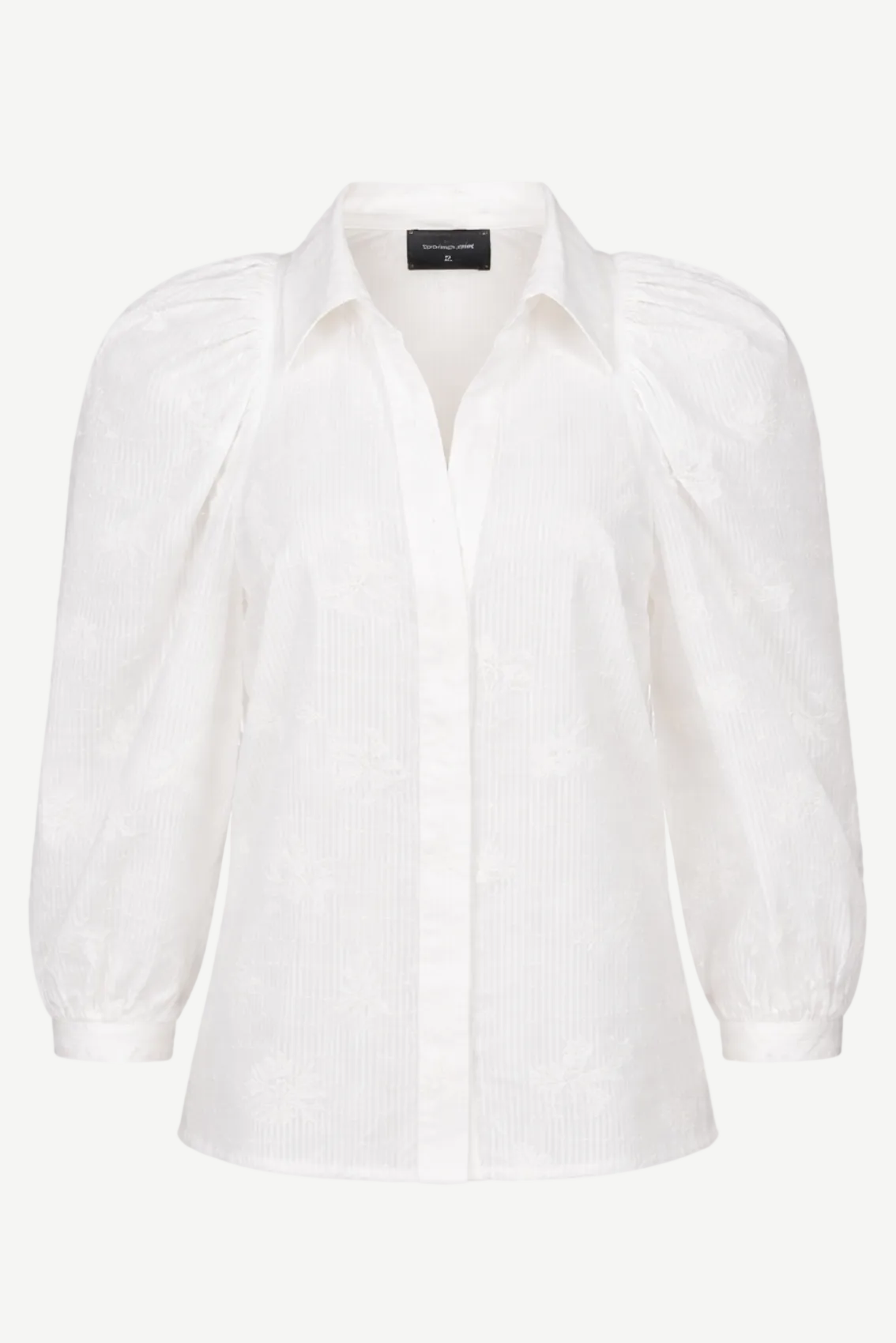 weißen Bluse mit floraler Stickerei, strukturierter Baumwolle und verdeckter Knopfleiste.